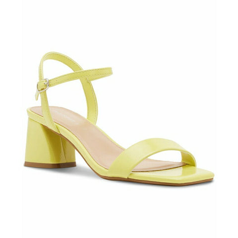 Yellow sandal with a block heel on a white background