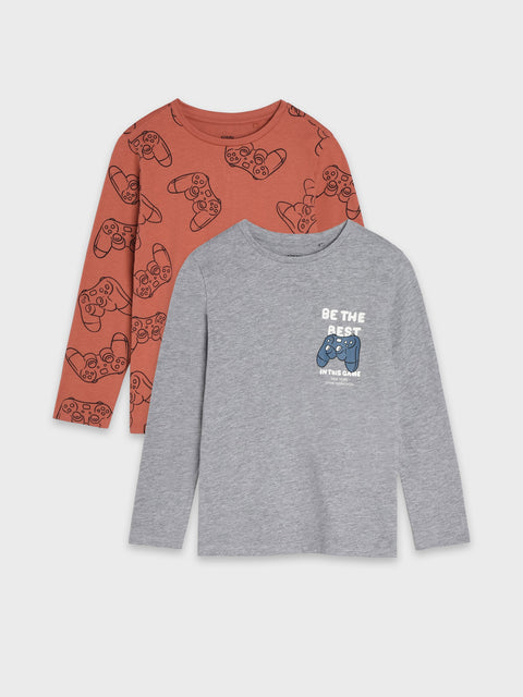 Two long-sleeve shirts, one with gaming controller patterns and the other with a joystick graphic, on a light gray background.