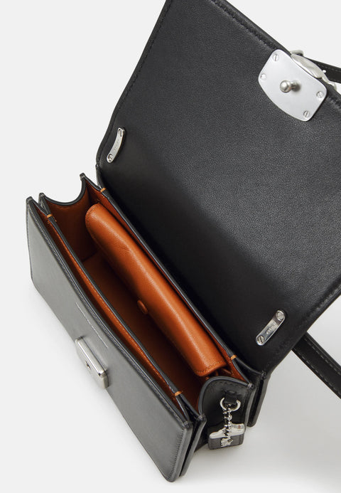 Black handbag with a brown interior on a white background
