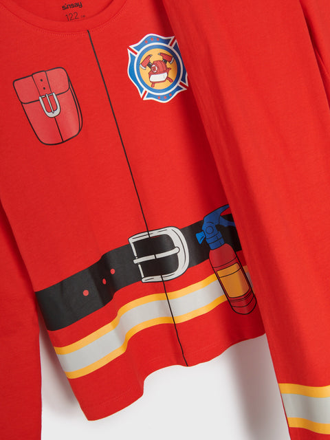 Red children's outfit with firefighter design on a white background
