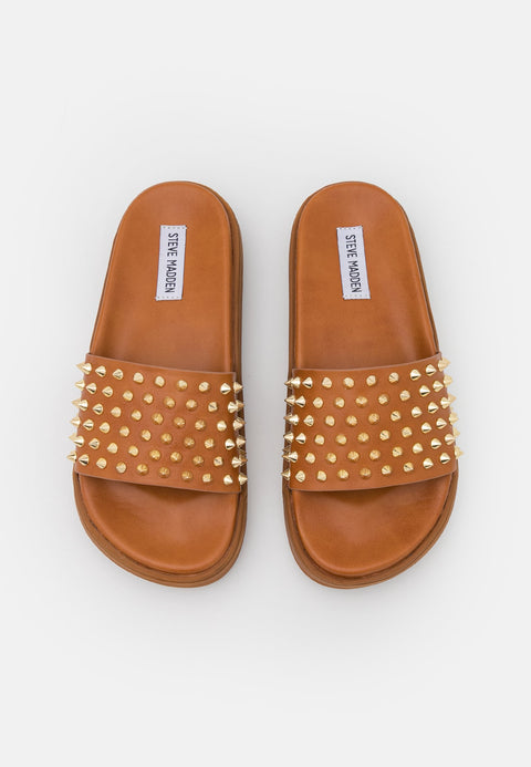 Tan sandals with gold studs on a white background