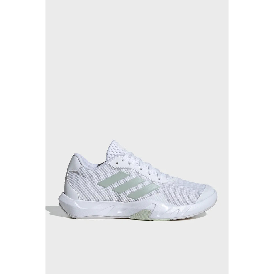 A white Adidas court shoe with light green three-stripes and a white sole, shown from a side profile on a light gray background.