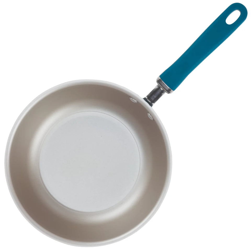 Frying pan with a blue handle on a white background