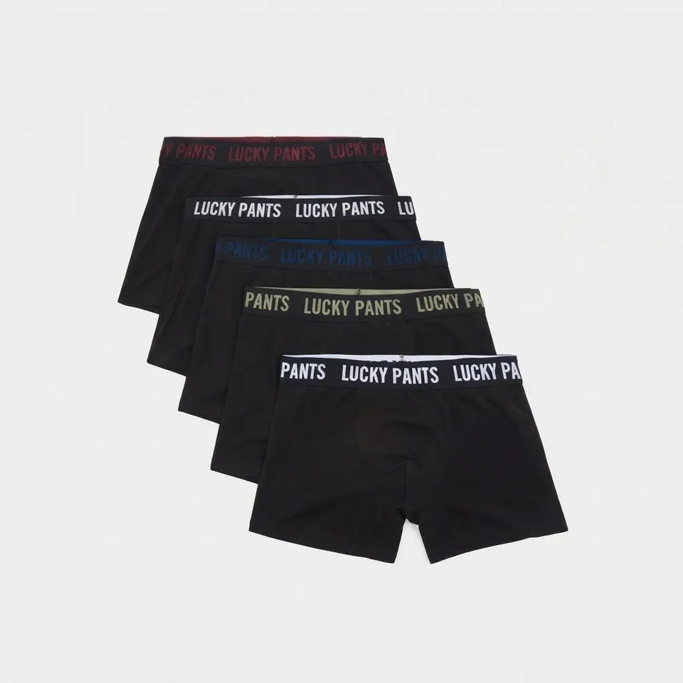 A 5-pack of Lucky Pants boxer briefs in black, arranged in a staggered fan layout on a light gray background. Each pair features a branded elastic waistband with different color text accents (red, white, blue, olive green, and white).