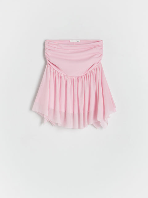 Pink strapless top on a white background