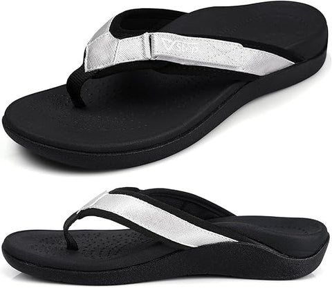 Black and white sandals with a strap on a white background