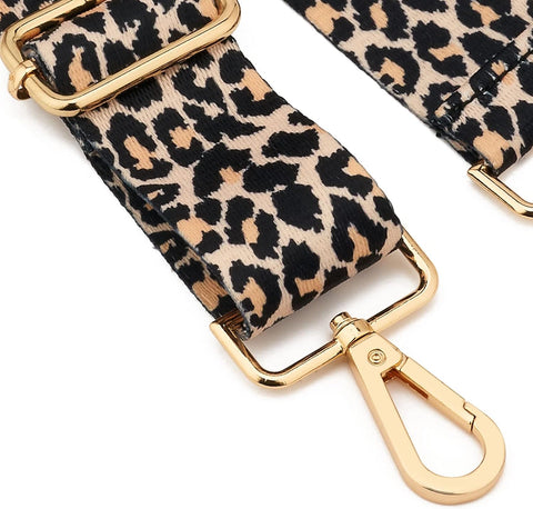 Leopard print strap with gold hardware on a white background