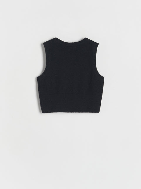 Black sleeveless top on a white background