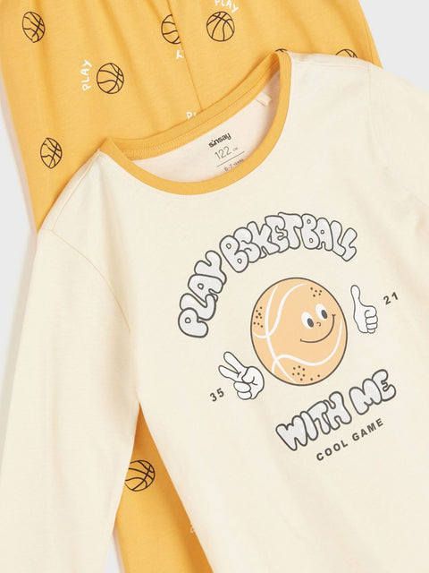 Children's t-shirt with basketball design and text on a white background