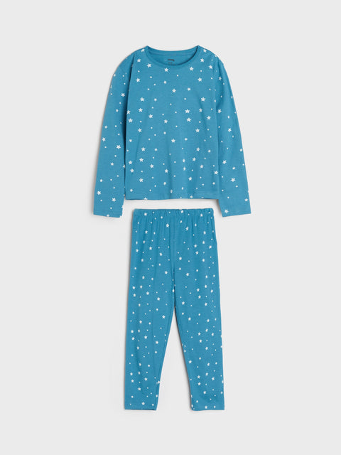 Blue pajama set with white star pattern on a light gray background
