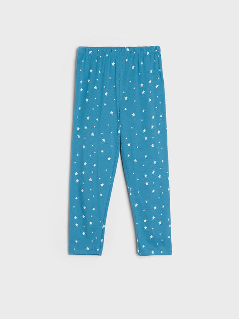 Blue leggings with white star pattern on a light gray background