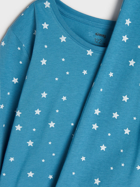 Blue shirt with white star pattern on a white background