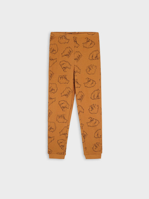 Brown jogger pants with bear pattern on a white background