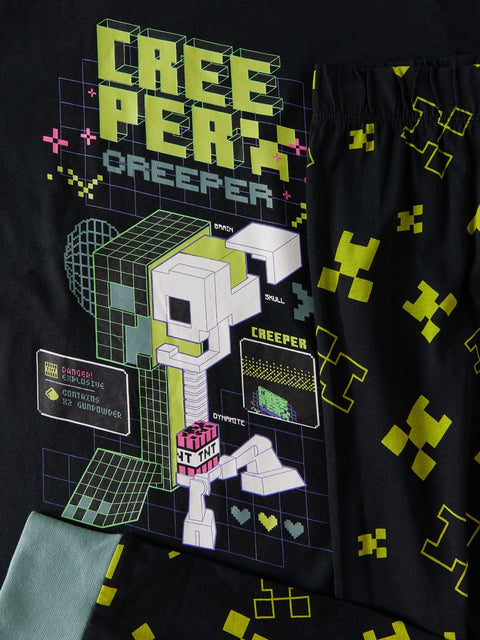 Black t-shirt with pixelated character design and 'Creeper' text on a black background.