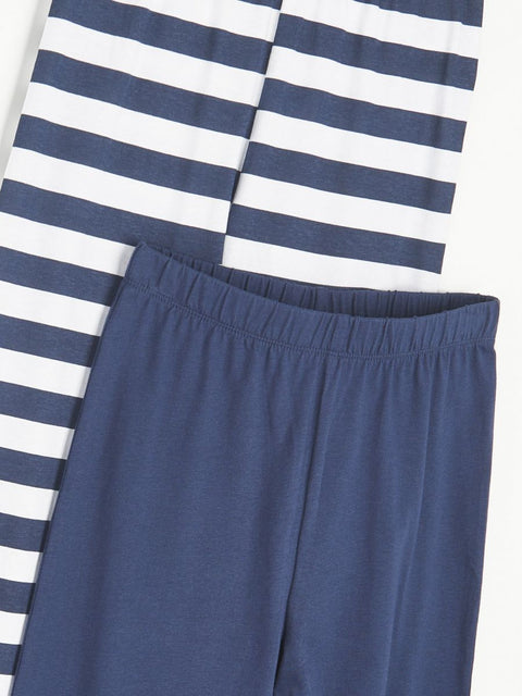 Navy and white striped shirt with blue pants on a white background