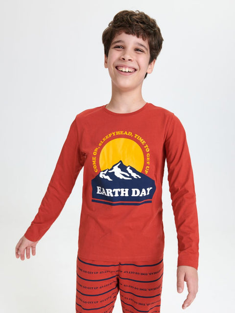 Child wearing a red 'Earth Day' pajama set with a graphic design on a white background