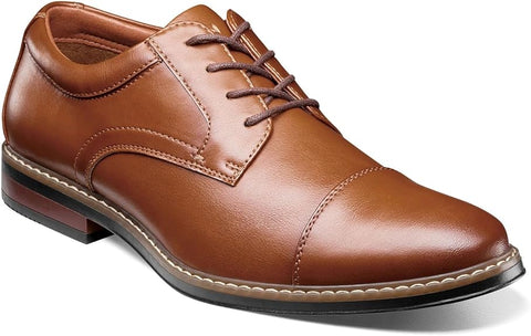 Brown leather dress shoe on a white background