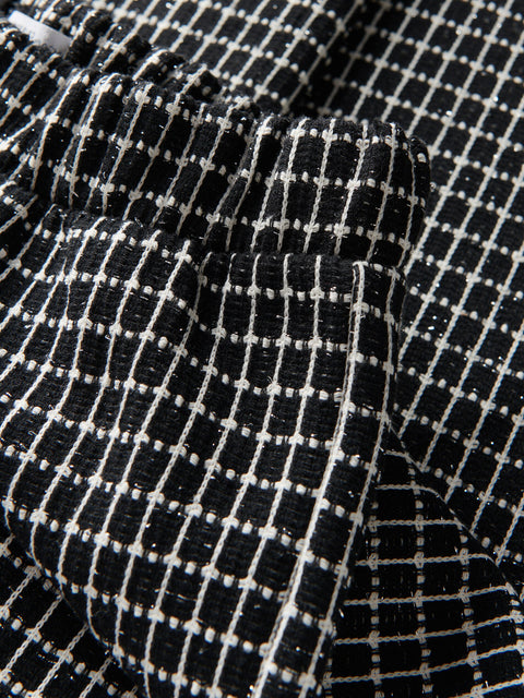 Close-up of black and white checkered fabric texture