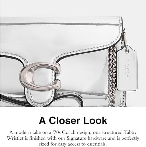 Coach structured Tabby Wristlet with signature hardware on a white background