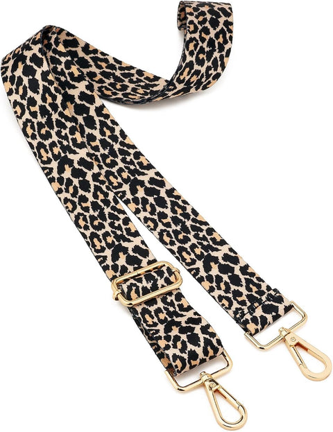 Leopard print bag strap with gold hardware on a white background