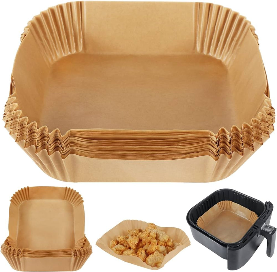 Set of brown paper food containers with a black appliance on a white background