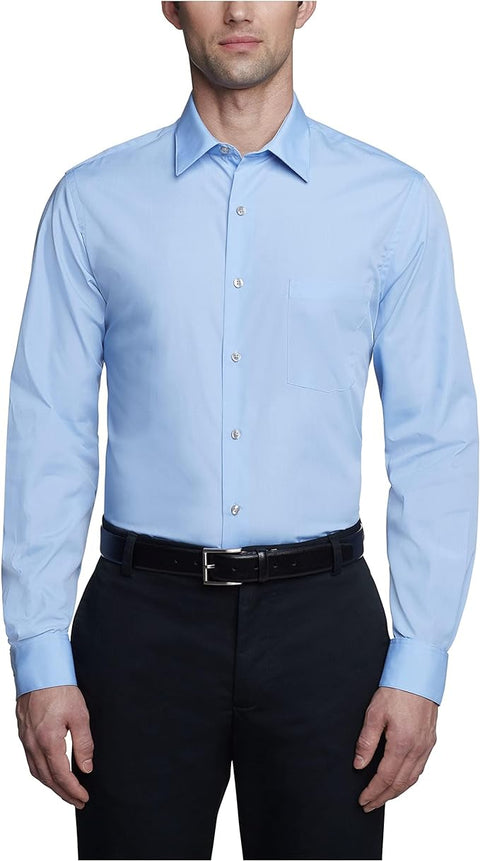 Man wearing a light blue dress shirt and black pants on a white background