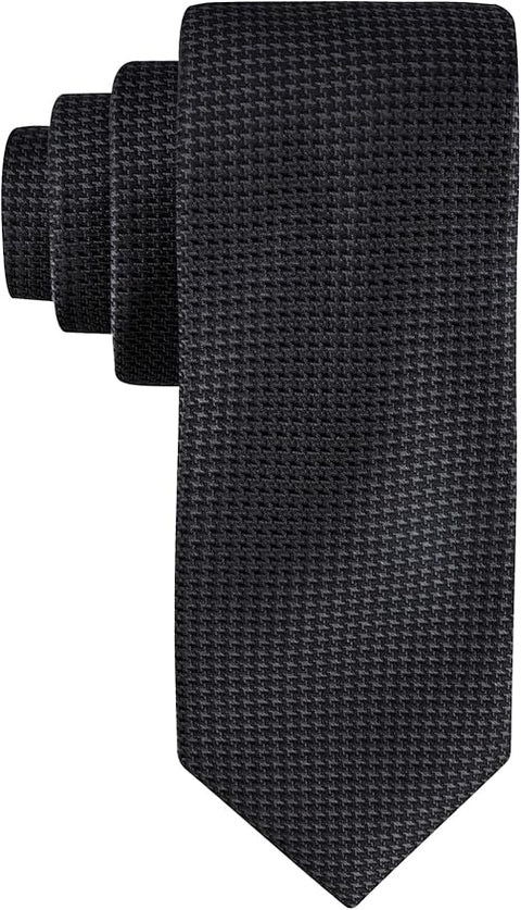 Set of black textured ties on a white background