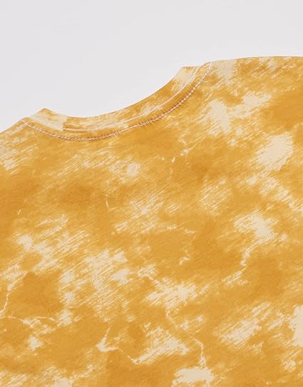 Close-up of a yellow tie-dye shirt with a plain background