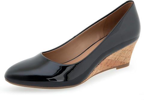 Black patent leather wedge shoe on a white background