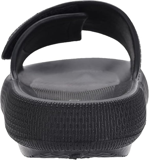 Black sandal with textured sole on a white background