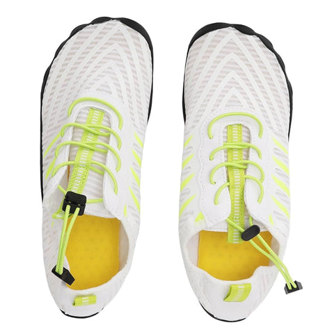 White sneakers with yellow laces and sole on a white background