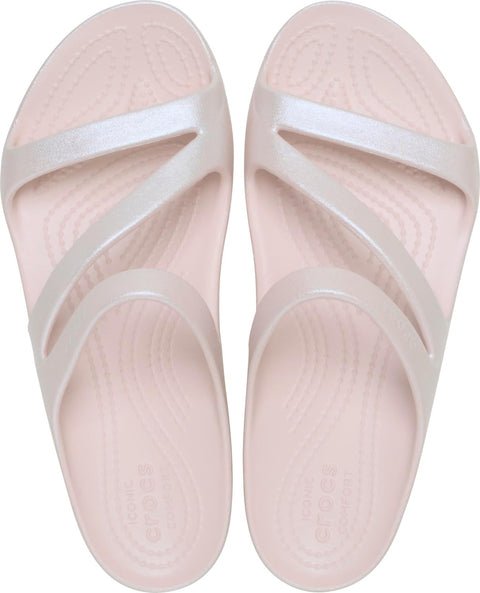 Pair of light pink slides with white straps on a white background