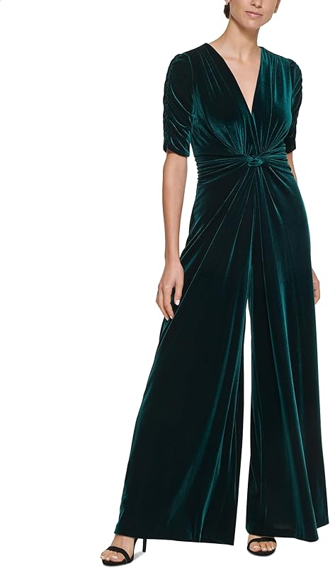 Green velvet jumpsuit worn by a model on a white background