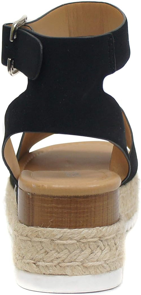 Black wedge sandal with woven sole on a white background