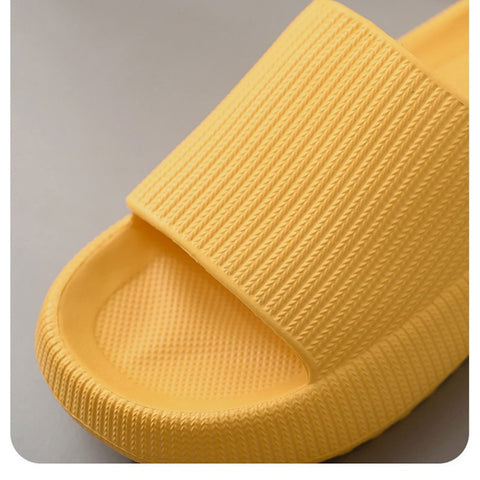 Yellow slide sandal on a gray background