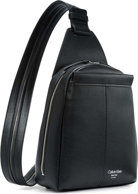 Black leather sling bag with Calvin Klein logo on a white background