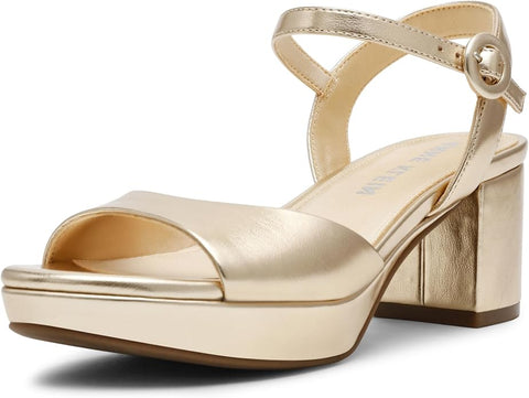 Gold high-heeled sandal on a white background