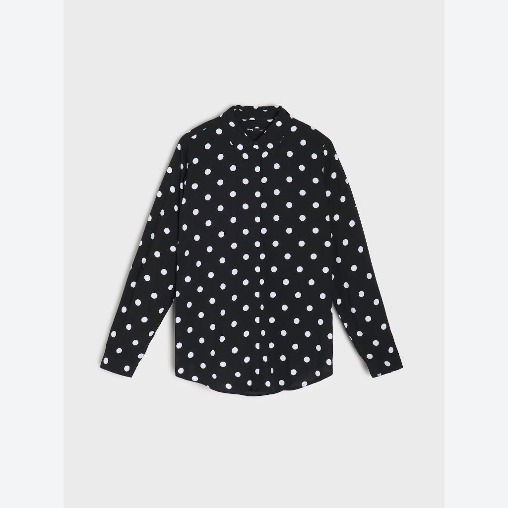 A black long-sleeve button-up shirt with a white polka dot pattern, displayed flat against a light gray background.