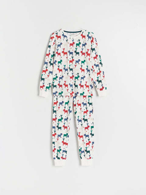 Children's onesie with multicolored dog pattern on a white background