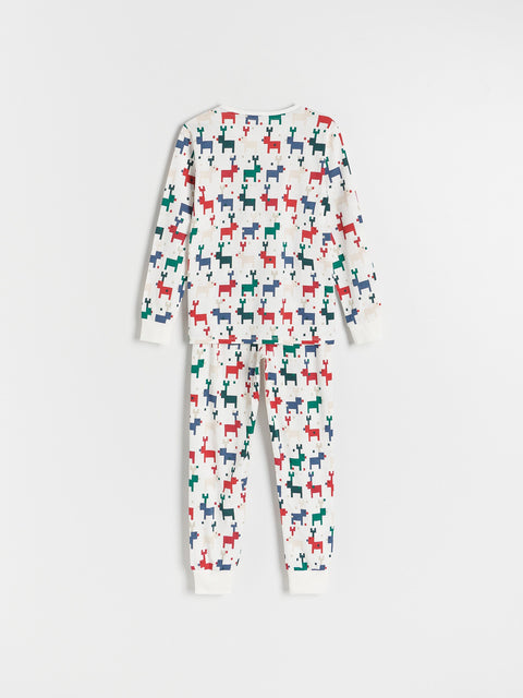 Children's onesie with multicolored dog pattern on a white background