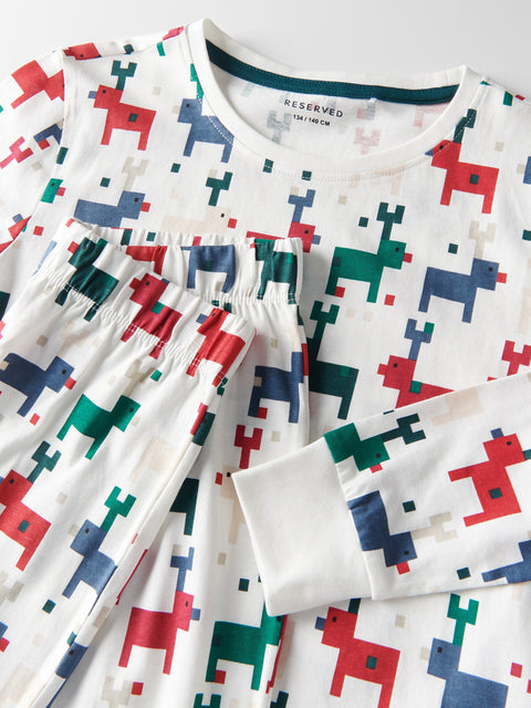 White shirt with colorful geometric pattern on a white background