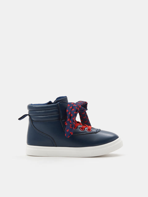 Navy high-top sneaker with red and blue patterned laces on a white background