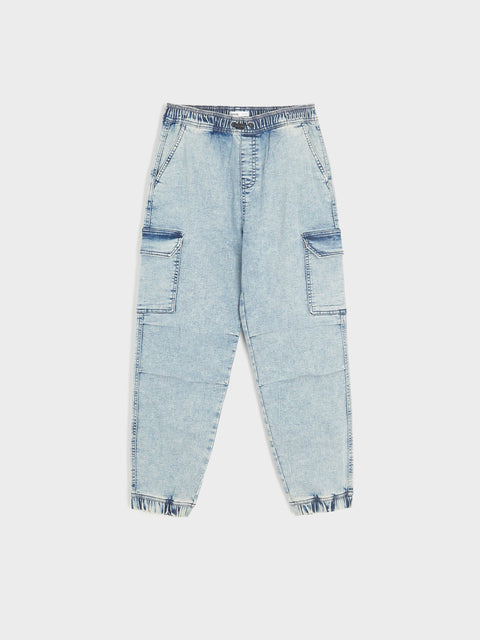 Light blue denim jeans with patch pockets on a white background