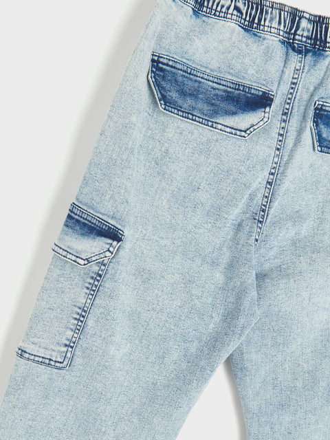 Light blue jeans with a white background