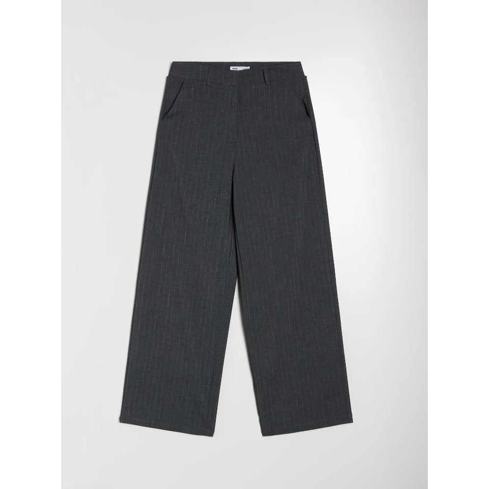 A pair of dark gray pinstriped trousers laid flat against a light gray background.