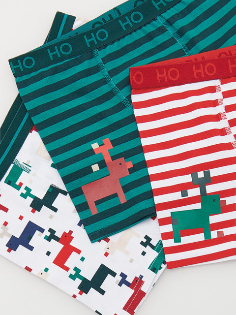 Set of Christmas-themed boxer briefs with reindeer designs on a white background