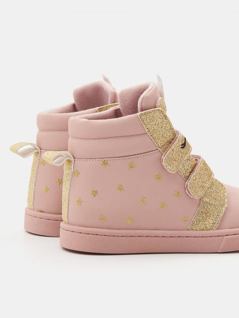 Pink high-top sneakers with gold accents on a white background