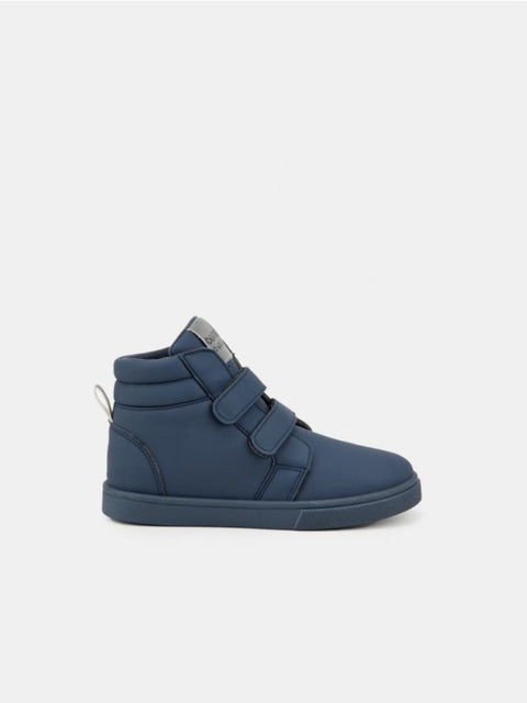 Blue high-top sneaker with velcro straps on a white background
