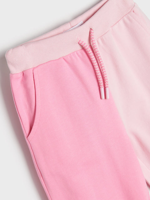 Close-up of pink pants with a white background