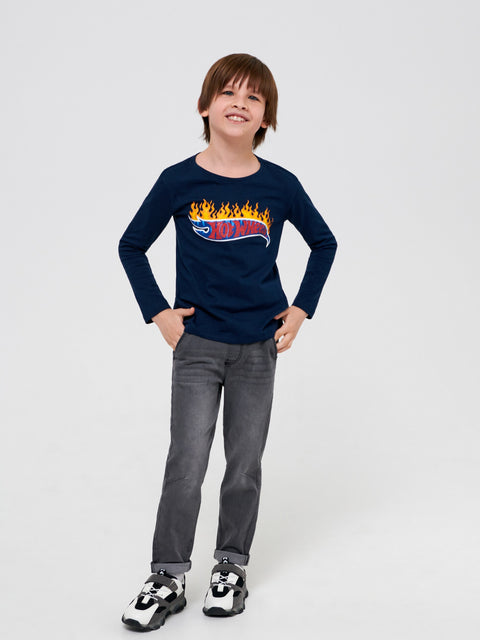 Child wearing a navy blue long-sleeve shirt with a graphic design on a white background